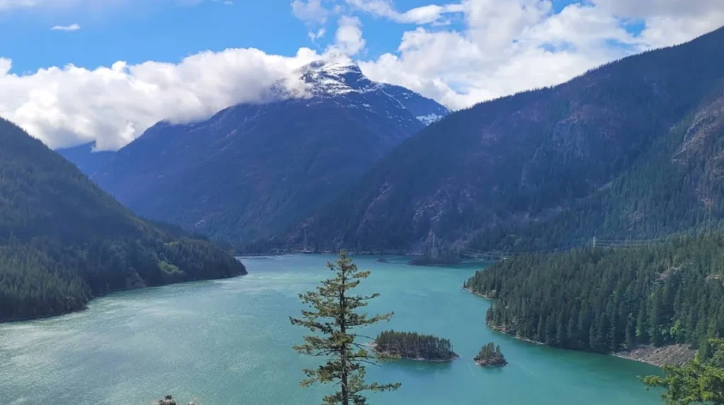 What is the geographic trajectory of the North Cascades Scenic Drive?